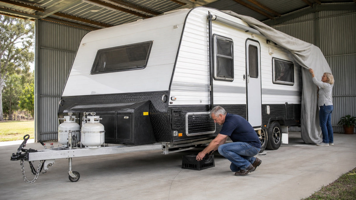 Owners preparing an Australian caravan for covered storage