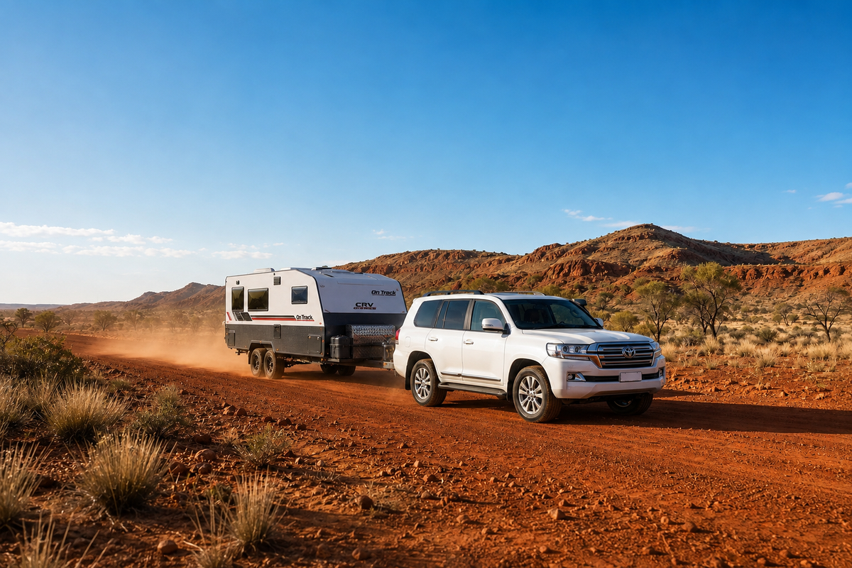 Tow vehicle and caravan on a remote Australian road with long distances between services