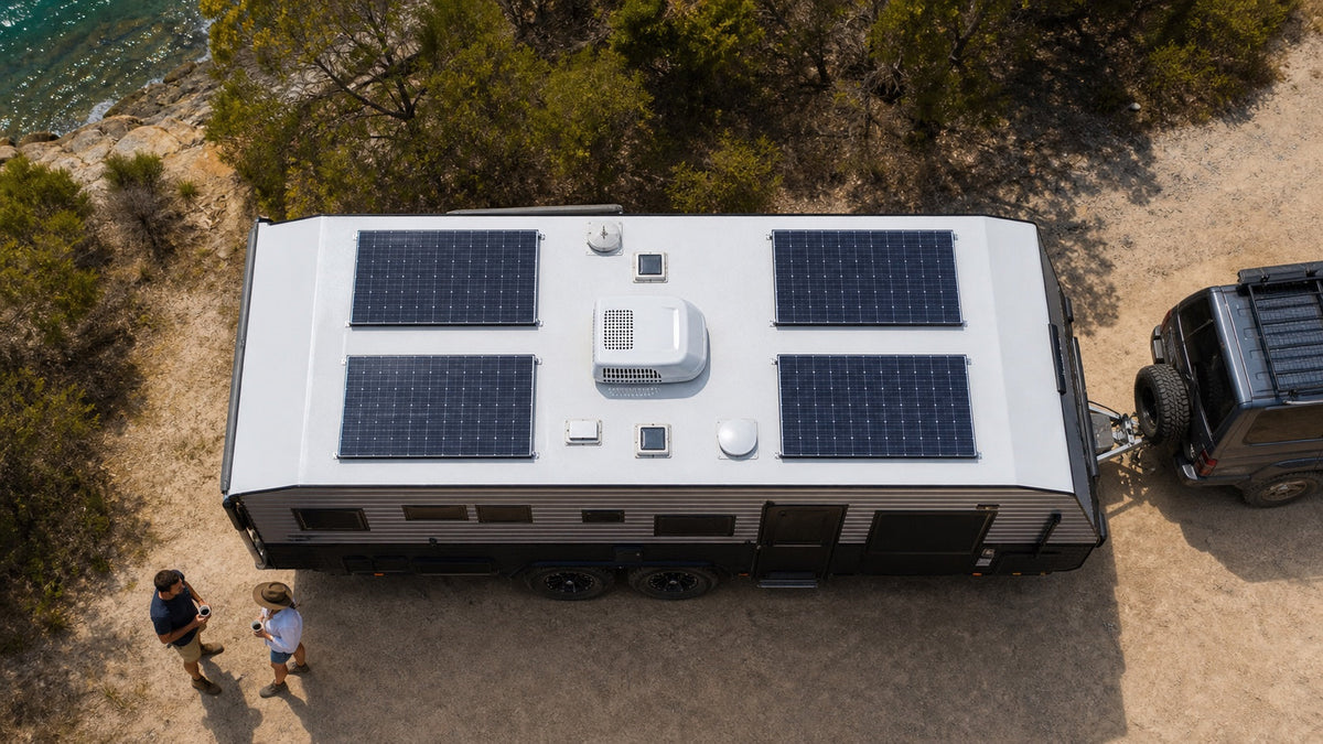 Overhead view of four fixed flat solar panels balanced across both sides of an Australian caravan roof