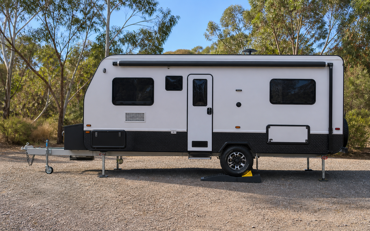 Australian caravan with correctly positioned wheels supported on purpose-made levelling ramps
